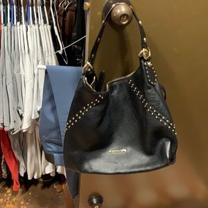 Black leather Michael kors. Gold studded